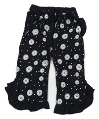 Černé culottes květované kalhoty s volánky