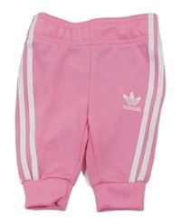 Růžovo-bílé sportovní tepláky s pruhy a logem Adidas