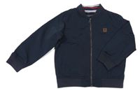 Tmavomodrý šusťákový podzimní bomber s nášivkou Next