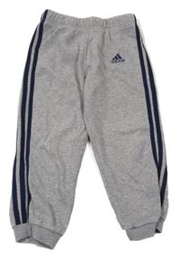 Šedo/melírovano-tmavomodré tepláky Adidas