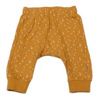 Hořčicové vzorované baggy tepláky Hema